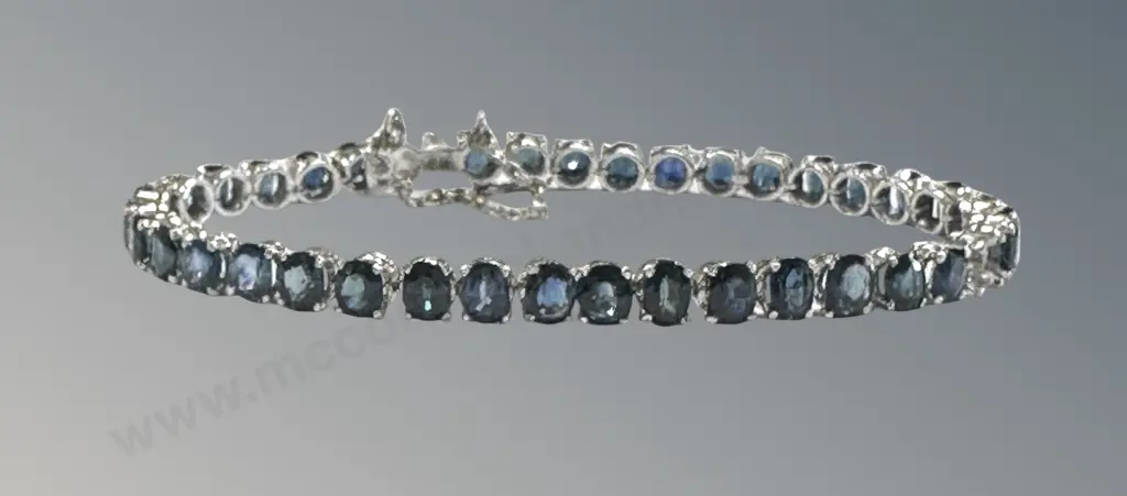 18ct White Gold 39 Stone Sapphire Tennis Bracelet, one stone missing, L22cm, TW9.7gms Image 1++