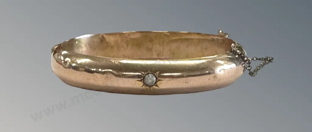 14ct Gold Snap Bangle with Centralized Pearl Inset, TW31.7gms Image 1++