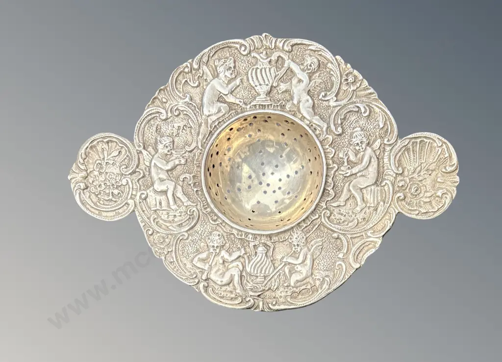 Ornate Sterling Silver Tea Strainer with Figural Border TW47.6gms Image 1++