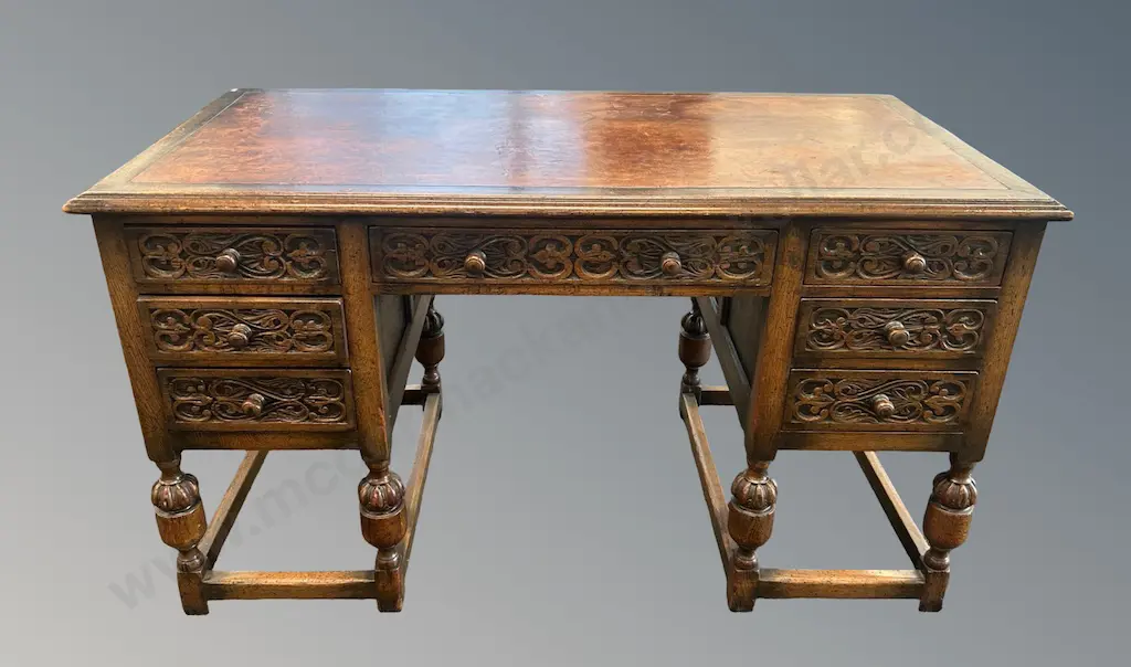 Oak Jacobean Style Writing Desk with Leather Inlay, Seven Drawers and Intricately Carved Drawers H77xL136xD69cm Image 1++
