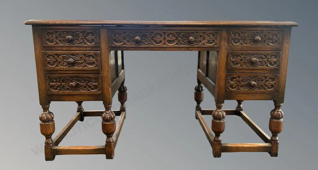 Oak Jacobean Style Writing Desk with Leather Inlay, Seven Drawers and Intricately Carved Drawers H77xL136xD69cm Image 1++