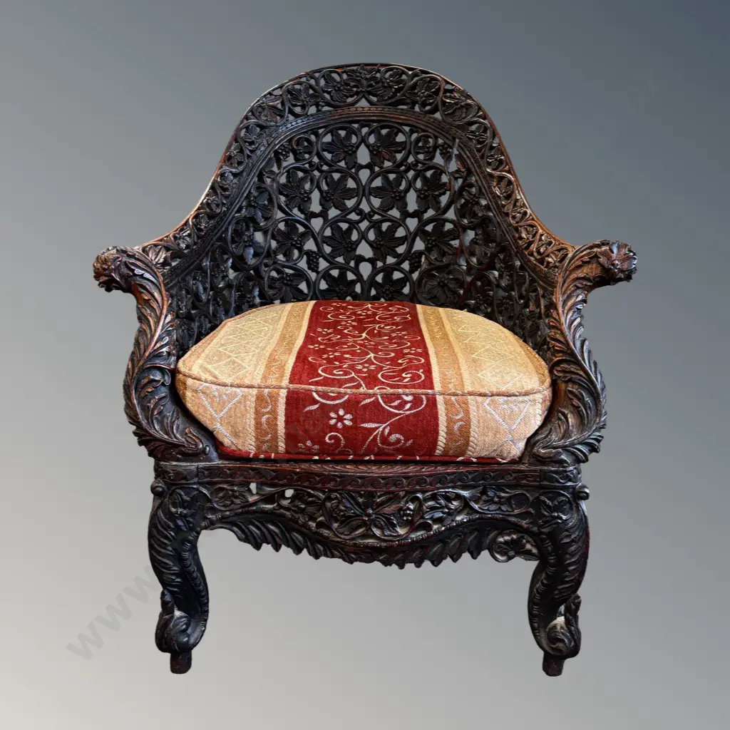 19C Armchair with Upholstered Seat Featuring Intricate Teak Wood Carving of Grape and Leaf Motifs Image 1++