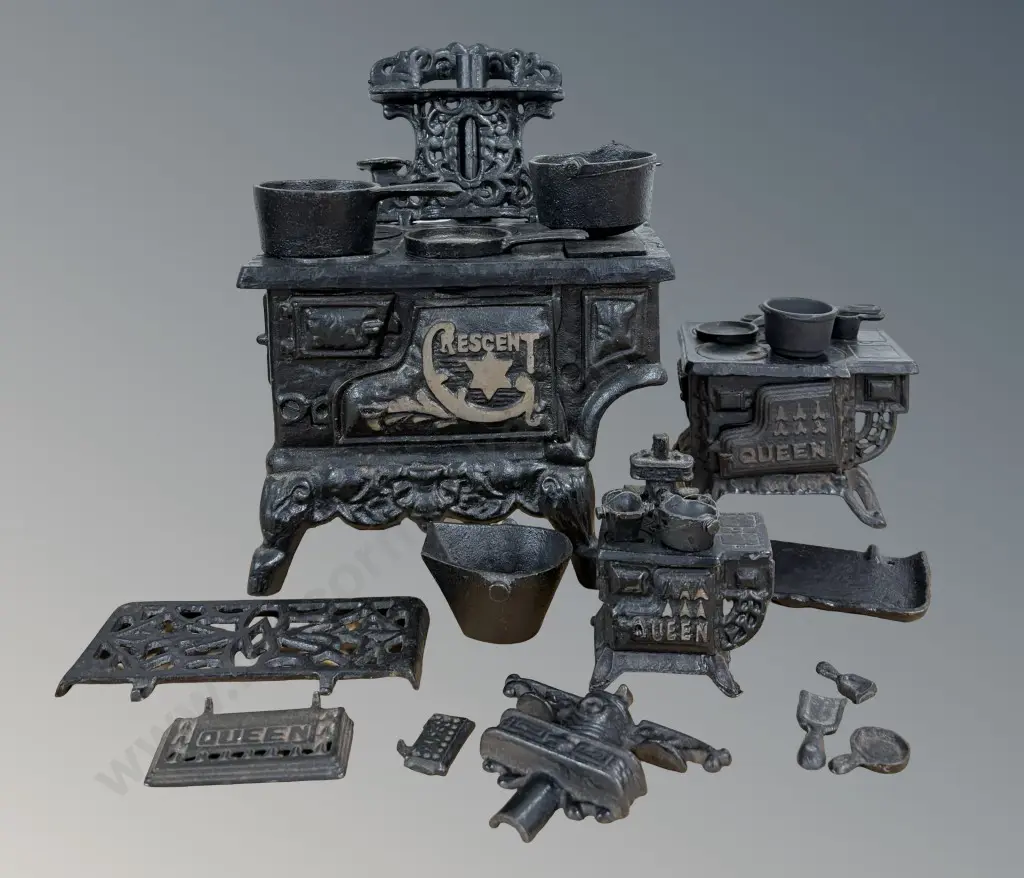 Three Cast Iron 'Crescent' Toy Stoves with Accessories Image 1++
